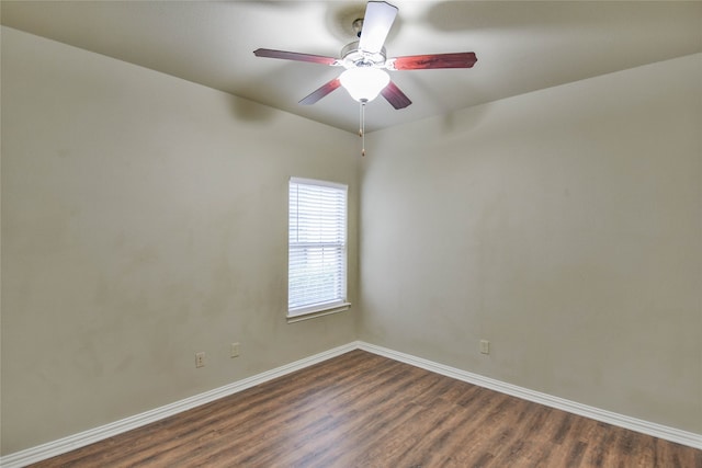 unfurnished room with dark hardwood / wood-style floors and ceiling fan