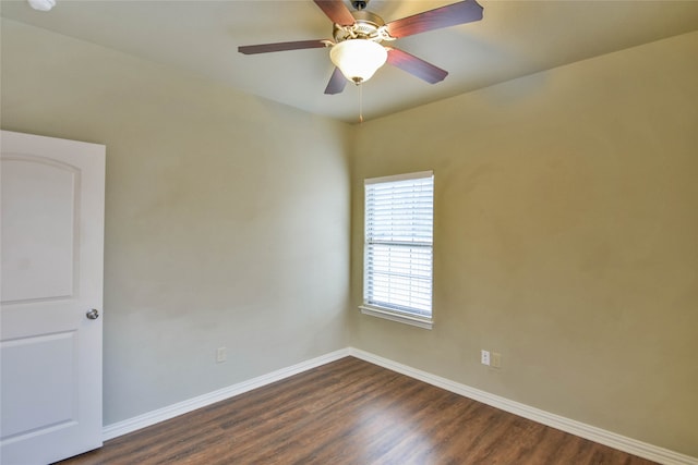 empty room with ceiling fan and dark hardwood / wood-style floors