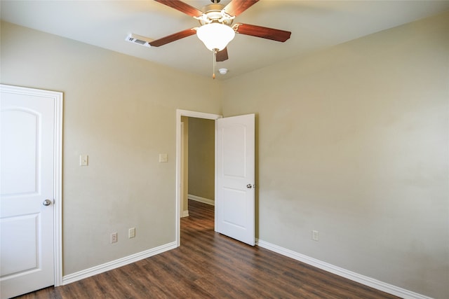 unfurnished bedroom with dark hardwood / wood-style floors and ceiling fan