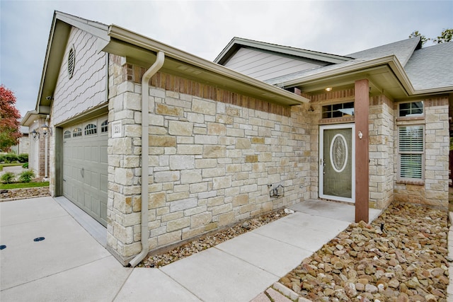 entrance to property featuring a garage