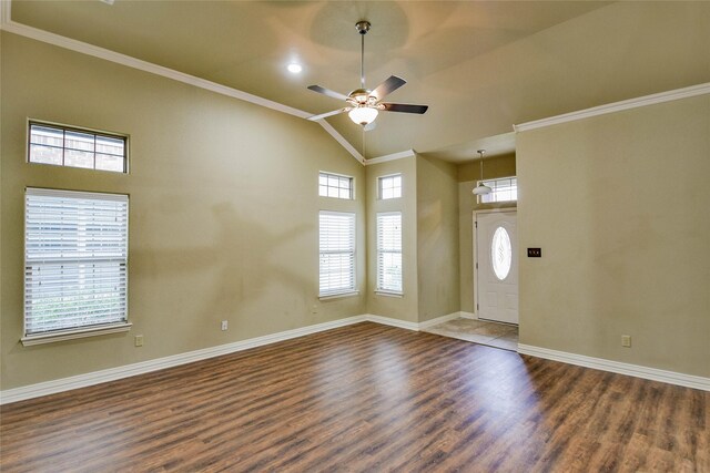 foyer with dark hardwood / wood-style floors, ceiling fan, ornamental molding, and lofted ceiling