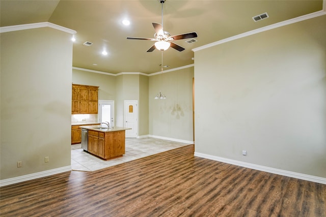 unfurnished living room with vaulted ceiling, ceiling fan, crown molding, sink, and light hardwood / wood-style flooring