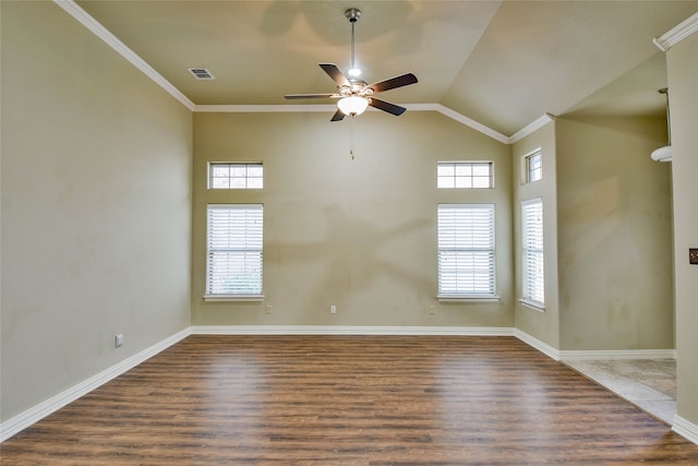 empty room featuring ceiling fan, dark hardwood / wood-style flooring, lofted ceiling, and ornamental molding