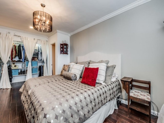 bedroom with ornamental molding and a chandelier