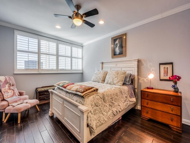 bedroom featuring ceiling fan, ornamental molding, and dark hardwood / wood-style floors