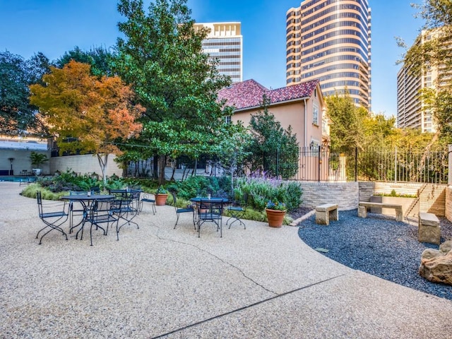 view of patio / terrace featuring fence