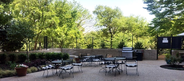 view of patio / terrace with fence and grilling area