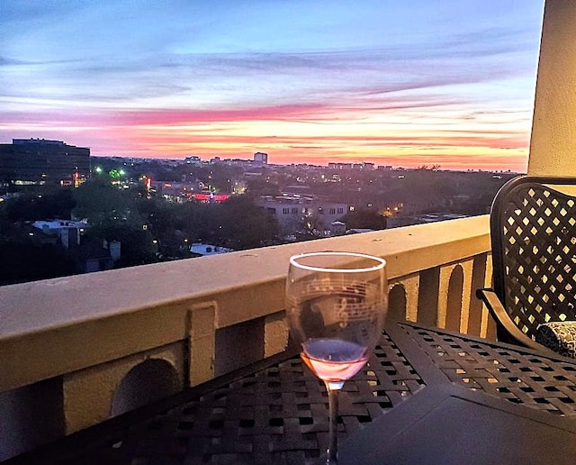 view of balcony at dusk