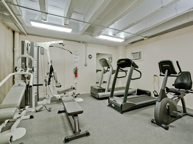 exercise room with an AC wall unit