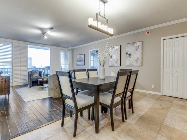 3701 Turtle Creek Blvd Unit 11H, Dallas, TX 75219 - dining area featuring ornamental molding, baseboards, and a chandelier