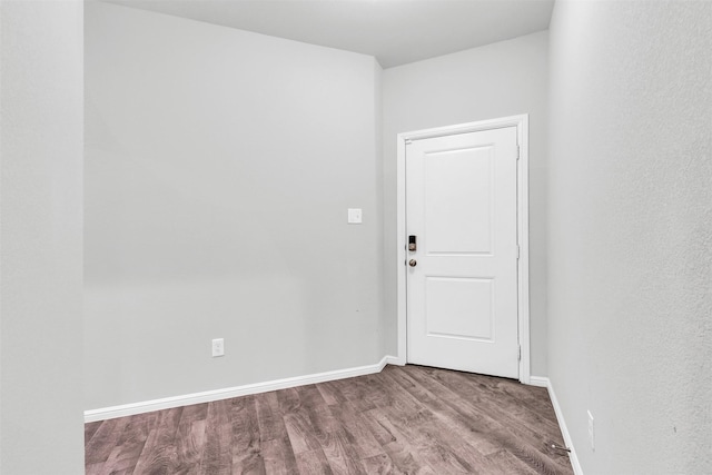 empty room featuring hardwood / wood-style flooring