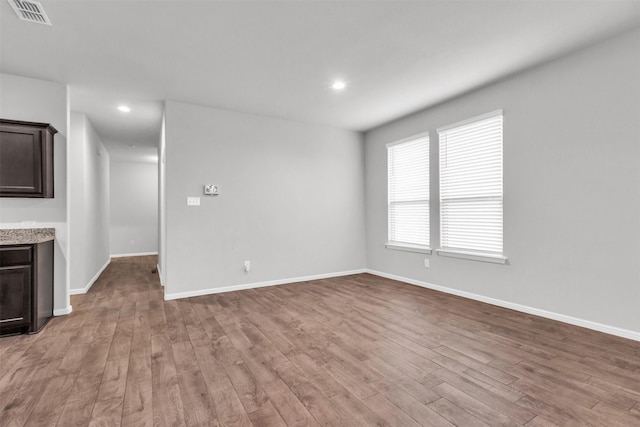 unfurnished living room with light hardwood / wood-style flooring