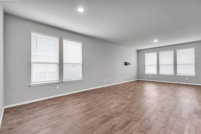 empty room with light hardwood / wood-style floors