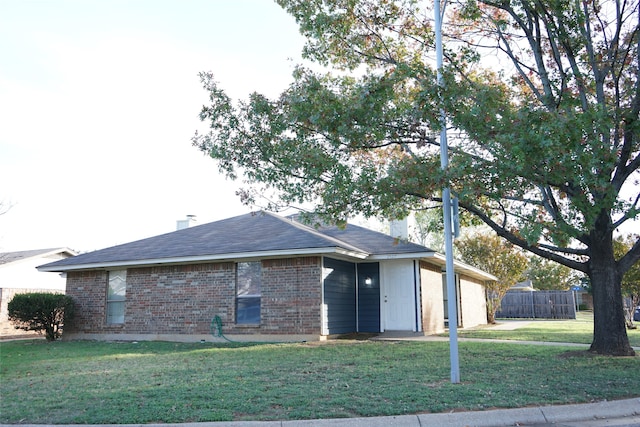 view of front of home with a front yard