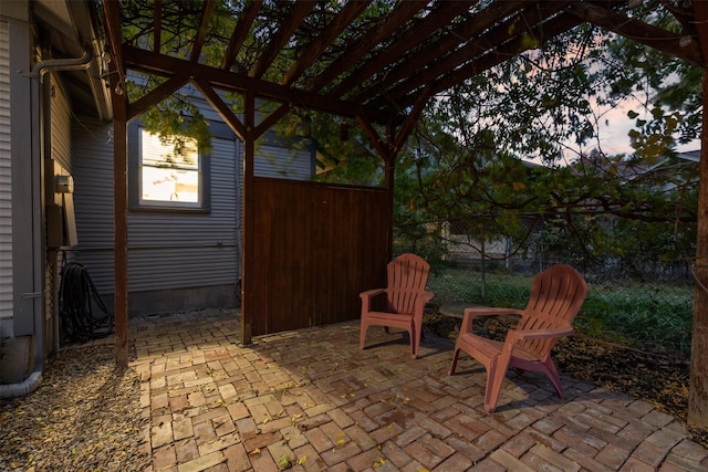 view of patio terrace at dusk