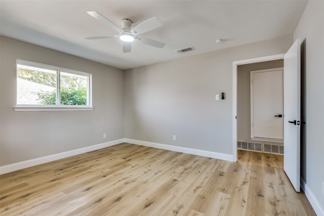 unfurnished room featuring ceiling fan and light wood-type flooring