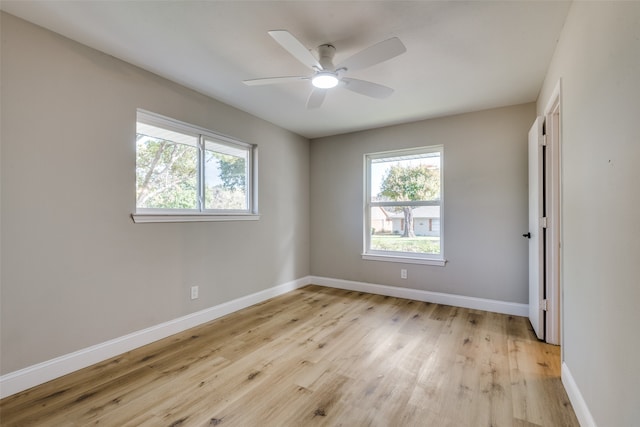 empty room featuring ceiling fan and light hardwood / wood-style flooring