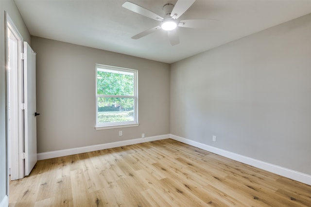 spare room featuring ceiling fan and light wood-type flooring