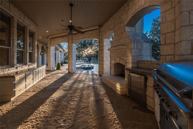 view of patio / terrace featuring area for grilling and ceiling fan