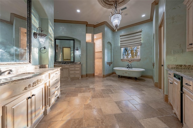 bathroom featuring vanity, ornamental molding, a tub, and a chandelier