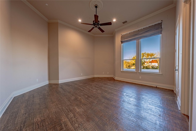 empty room with ceiling fan, dark hardwood / wood-style flooring, and ornamental molding