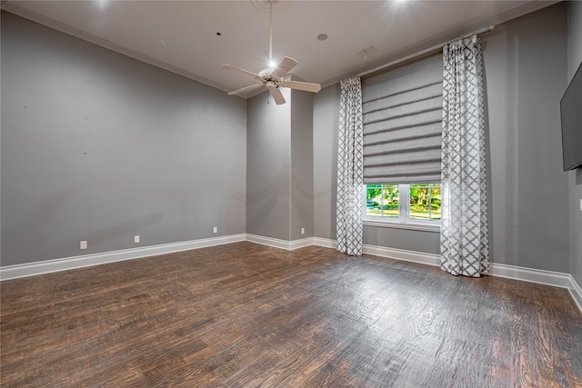 spare room featuring ceiling fan, dark wood-type flooring, and ornamental molding