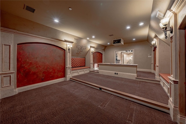 carpeted cinema featuring lofted ceiling