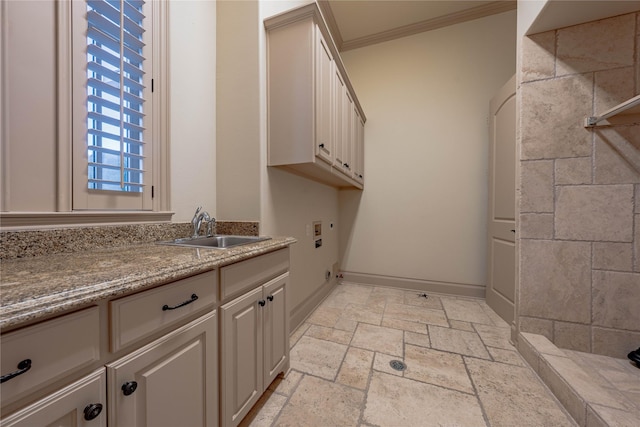 bathroom featuring ornamental molding and sink