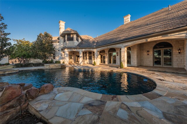 view of pool featuring a patio