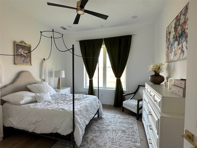 bedroom featuring ceiling fan and dark hardwood / wood-style flooring