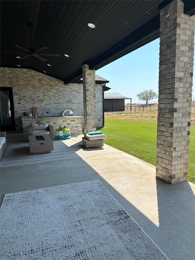 view of patio / terrace featuring ceiling fan