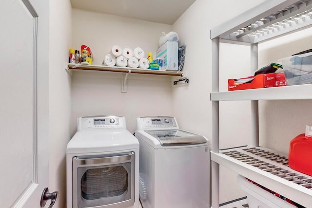 laundry room featuring separate washer and dryer