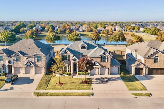 view of front facade featuring a front lawn and a water view