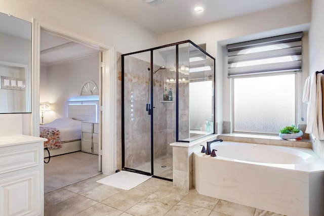 bathroom with independent shower and bath and vanity