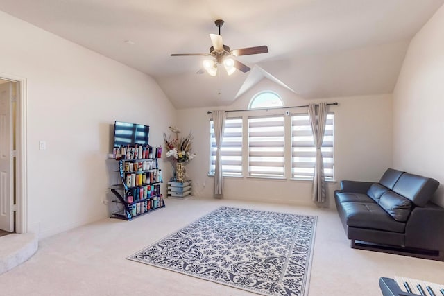 interior space with vaulted ceiling, ceiling fan, and carpet