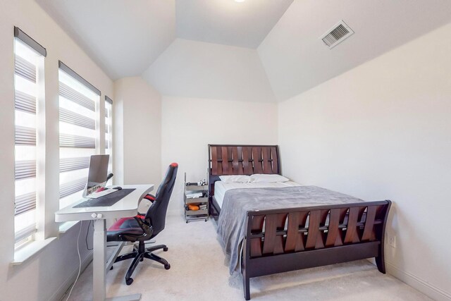 carpeted bedroom featuring vaulted ceiling