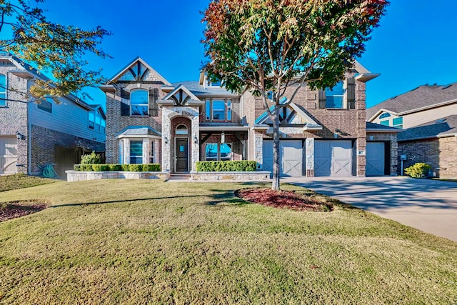 view of front of house featuring a garage and a front yard