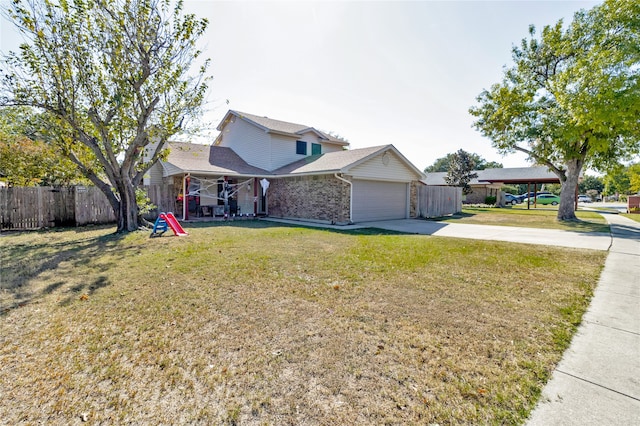 front of property featuring a garage and a front lawn