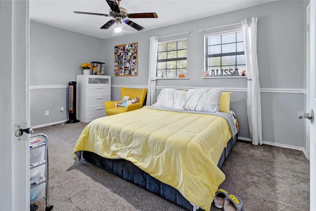 bedroom featuring a textured ceiling, ceiling fan, and carpet flooring