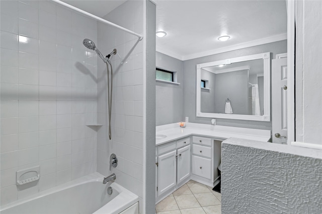 bathroom featuring tile patterned flooring, vanity, tiled shower / bath combo, and ornamental molding