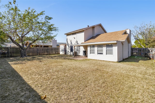 back of property featuring cooling unit and a lawn