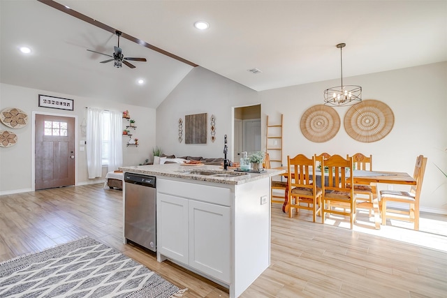 kitchen with white cabinets, dishwasher, a center island, hanging light fixtures, and light wood-type flooring