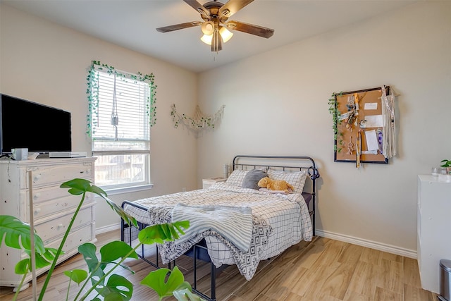 bedroom featuring ceiling fan and light hardwood / wood-style flooring