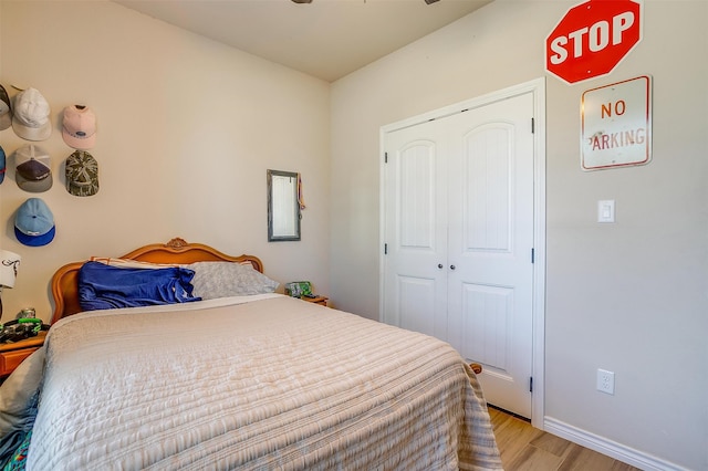 bedroom with a closet and light hardwood / wood-style floors