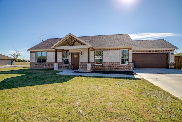 view of front facade with a garage and a front yard