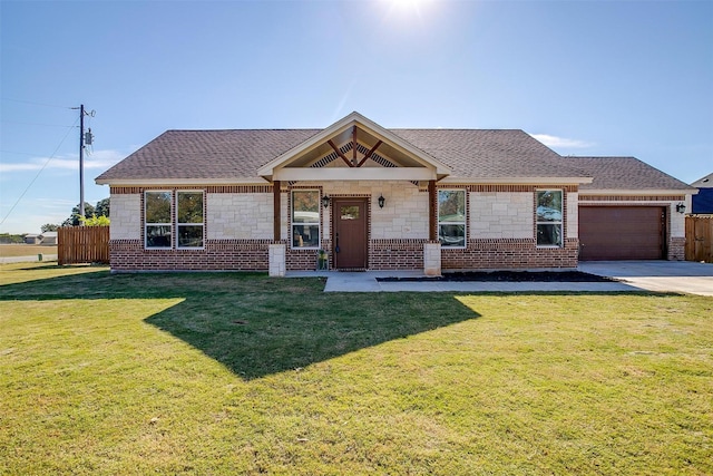 view of front of house with a garage and a front yard