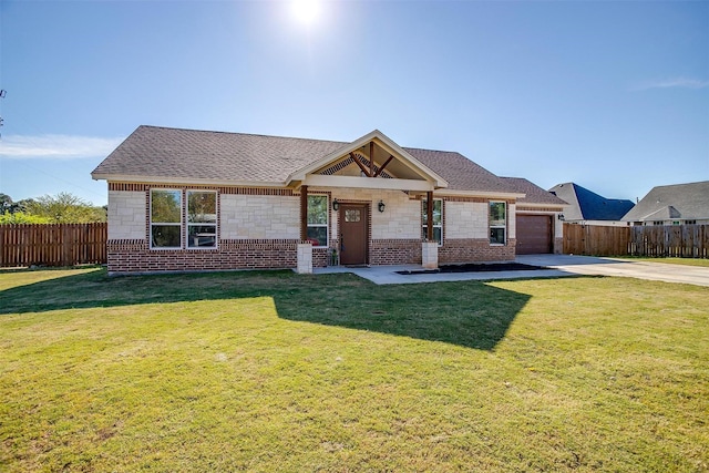 view of front of home featuring a front lawn and a garage