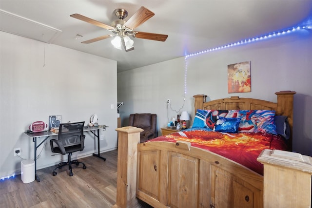 bedroom featuring wood-type flooring and ceiling fan