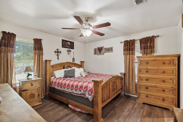 bedroom featuring dark hardwood / wood-style floors and ceiling fan