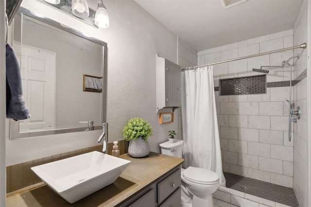 bathroom with vanity, toilet, and a shower with shower curtain